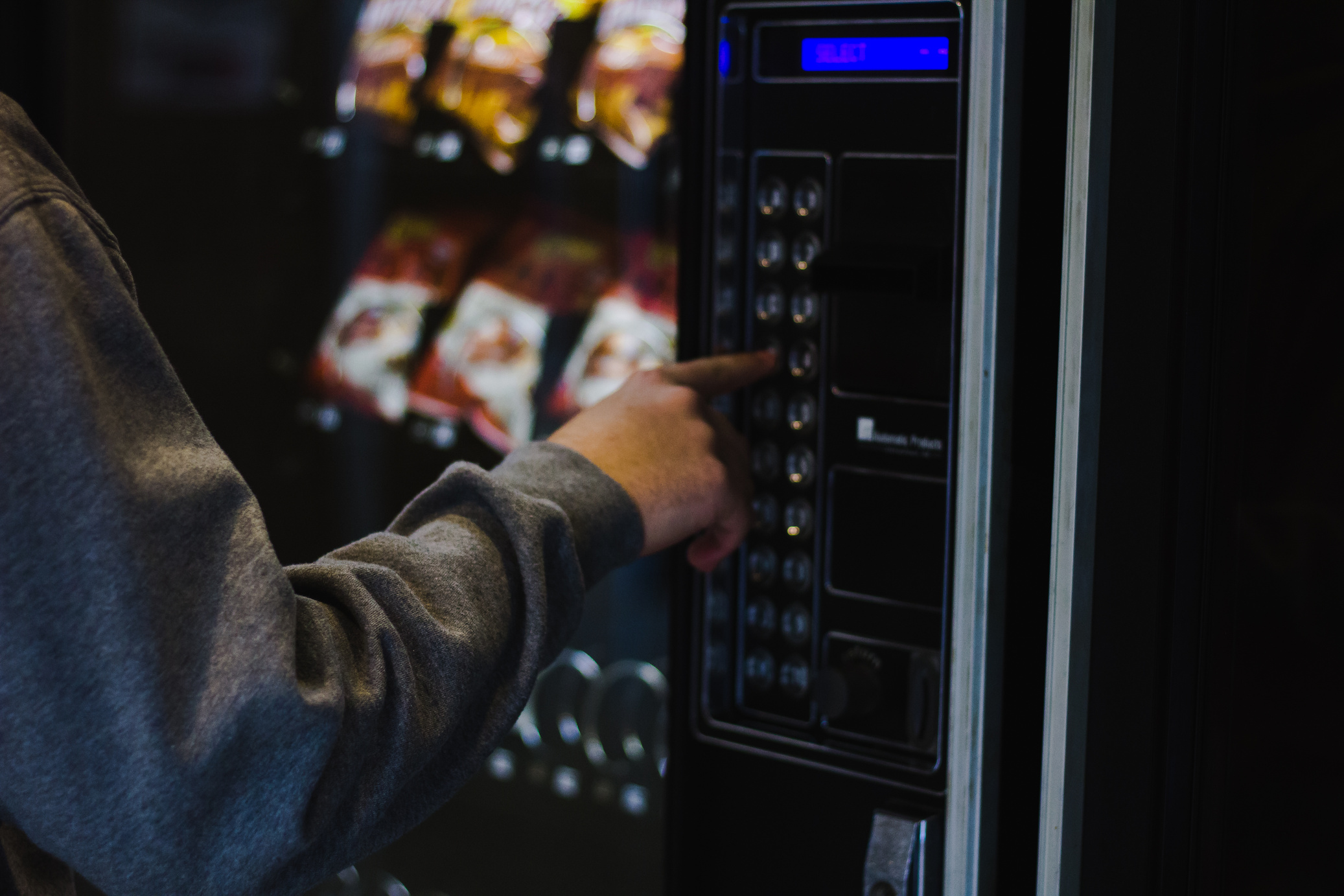 A Person Using a Vending Machine 